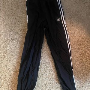 Adidas joggers . Super comfortable. Black . White stripped . Adidas logo.